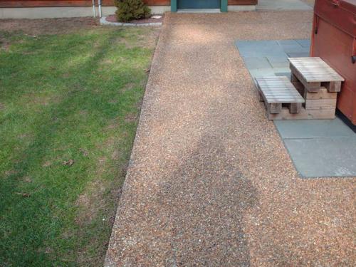 patio area around a hottub applied over an existing concrete patio
