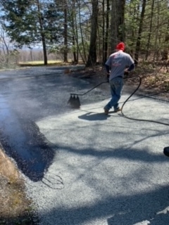 man brushing on fresh stone